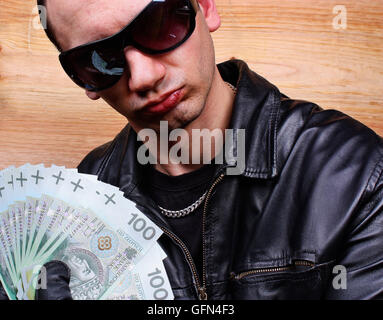 Mafia gangster with a fan polish money Stock Photo