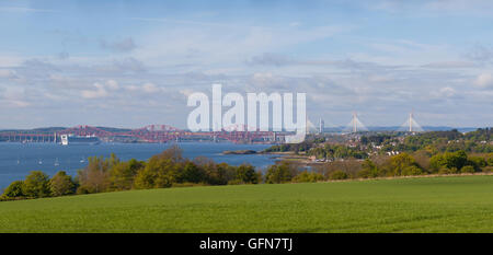 View from the Fife Coastal Path near Dalgety Bay looking towards the three Bridges over the Firth of Forth. Stock Photo