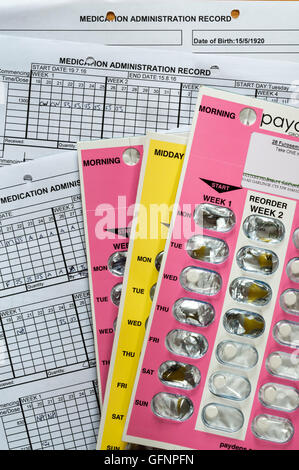 Medication Administration Record sheets with pills in blister packs - often used to dispense medication in care homes. Stock Photo