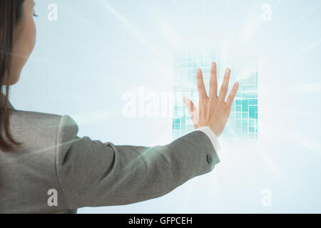 Japanese businesswoman interacting with virtual reality Stock Photo