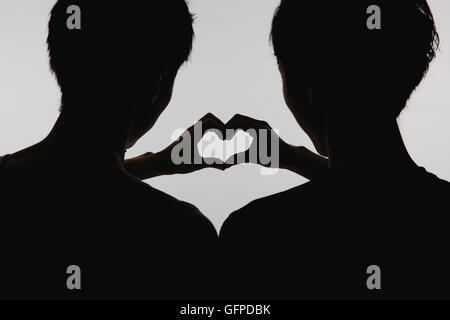Male couple silhouette Stock Photo - Alamy
