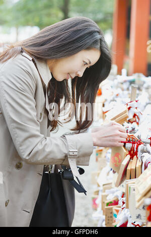 Young attractive Japanese woman at the temple Stock Photo