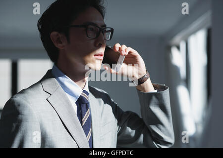 Japanese businessman in a modern office Stock Photo