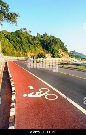 Bike lane in road beside the sea ,Nang Phaya View Point (Chalerm Burapa Chollathit Road),Chanthaburi, Thailand. Stock Photo