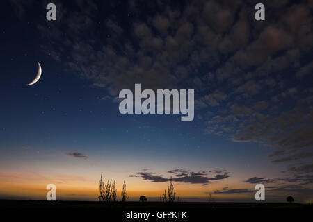 Beautiful night sky, moon, Beautiful clouds on night background. Moon Waning Crescent Stock Photo