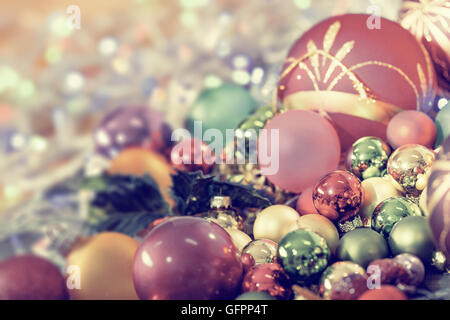 Christmas background with baubles and Christmas lights, shallow DOF, focus on the ball Stock Photo