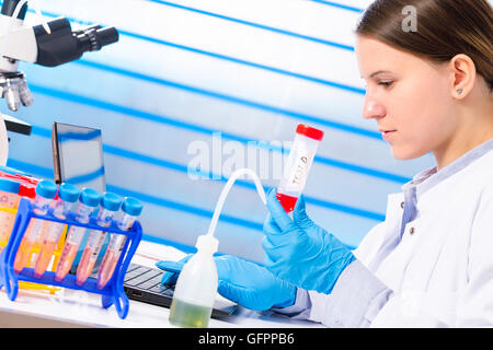 Woman doing experiments in a lab Stock Photo