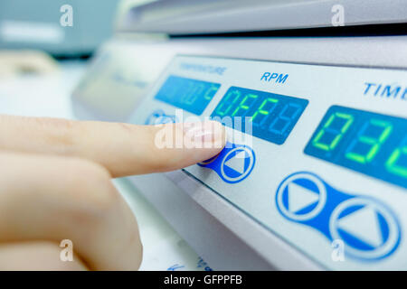 finger, pressing the button of the modern device. Stock Photo