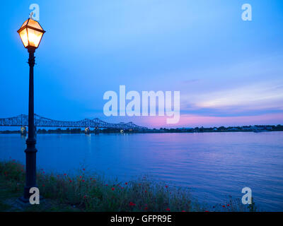 Sunset over the bridge at Natchez under the Hill by the mighty Mississippi River Stock Photo