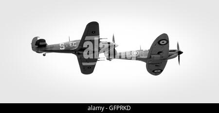 Black and White image of two vintage aircraft, a Hurricane and a Supermarine Spitfire. Both aircraft flew in the RAF in the Seco Stock Photo