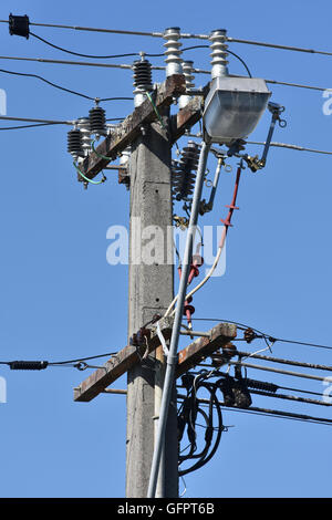 Electric wires in a street concrete pole Stock Photo - Alamy