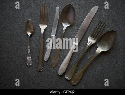 Vintage cutlery on black marble background Stock Photo