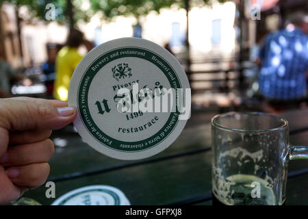 U Fleku is a famous pub and microbrewery in Old Town, beermat, Prague, Czech Republic Stock Photo