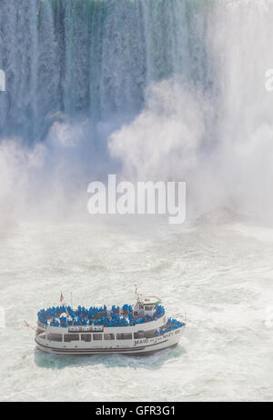 Niagara Falls, ON, Canada - July 5, 2015: View of a tour boat, Maid of the Mist, navigating near Niagara Falls. Stock Photo