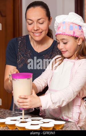 Baking cupcakes with mom Stock Photo