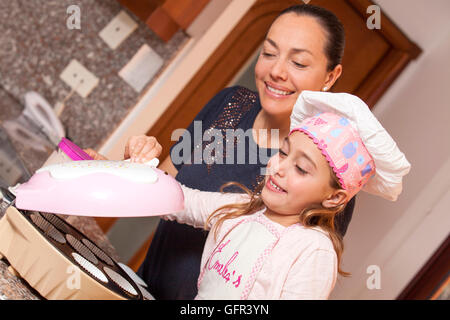 Baking cupcakes with mom Stock Photo
