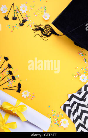 Yellow black and white theme graduation background with decorated borders on yellow background. Stock Photo