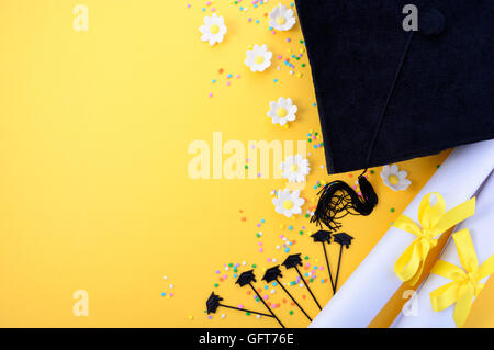 Yellow black and white theme graduation background with decorated borders on yellow background. Stock Photo