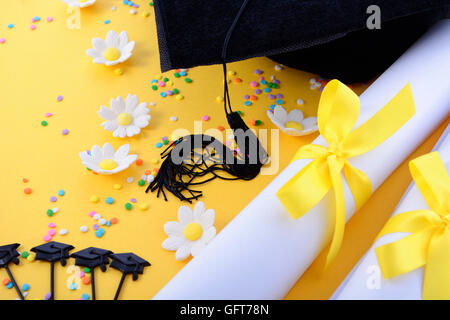 Yellow black and white theme graduation background with decorated borders on yellow background. Stock Photo