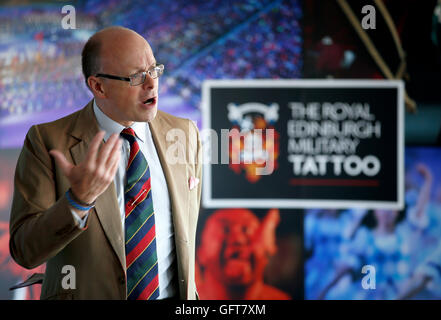 Brigadier David Allfrey, Chief Executive and producer of The Royal Edinburgh Military Tattoo, as he unveils the official programme for the 2016 'Tunes of Glory' military showcase on the Esplanade of Edinburgh Castle in Edinburgh, Scotland. Stock Photo