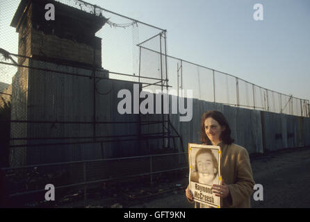 Hunger striker Raymond McCreesh poster, woman protesting out side of the Long Kesh Detention Centre, also known as the H-Blocks or and  HM Prison Maze, Lisburn Northern Ireland 1981 1980s UK HOMER SYKES Stock Photo