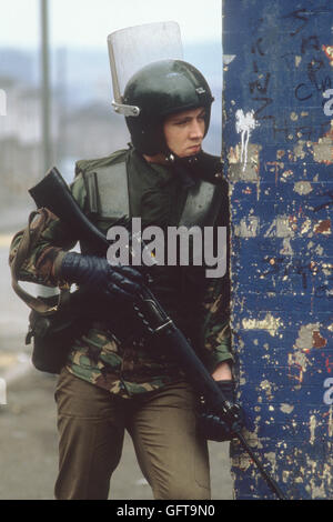 The Troubles, Belfast Northern Ireland armed British soldier on foot patrol 1981 1980s UK  HOMER SYKES Stock Photo