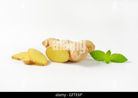 fresh ginger root on off-white background with shadows Stock Photo