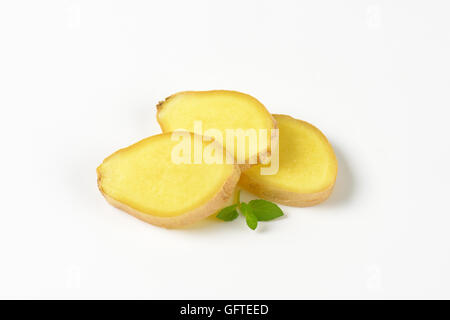 three slices of fresh ginger on white background Stock Photo