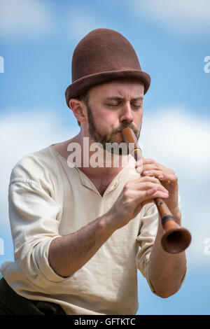 Man in medieval costumes playing on a piffero, Esrum, Denmark Stock Photo