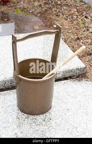 Japanese religious bucket and ladle to  baptize in the grave Stock Photo