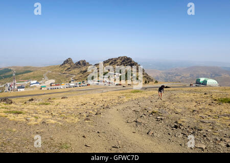 Road and barren landscape near ski resort, mountains of Sierra Nevada, Granada, Spain. Stock Photo