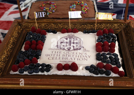 Street Party Held In Celebration Of Queen Elizabeth II 90th Birthday - Union Jack Cake With Raspberries And Blueberries In A Frame Cornwall Road Surrey England Stock Photo