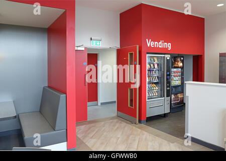 smart staff welfare area in a new factory showing kitchen facilities, seating and automatic vending machines Stock Photo
