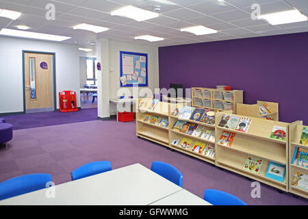 Library area in a new primary school. Shows books on display and seating space Stock Photo