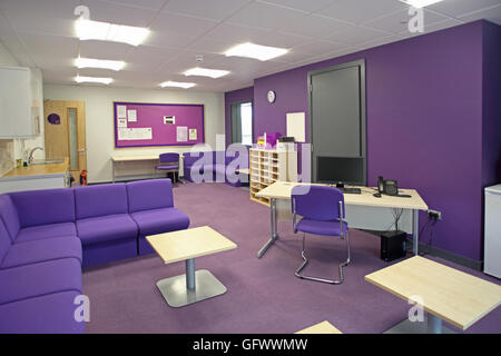 Staff administration and office area in a brand new London primary school. Shows desk and waiting area. Purple colour scheme. Stock Photo