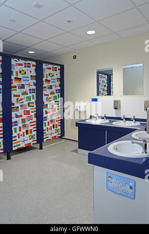 Toilets in a new primary school where the cubicle doors are decorated with the flags of the world Stock Photo