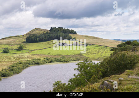 View from Hadrian's Wall looking east from above Crag Lough towards Hotbank Farm, and Hotbank crags Northumberland, England, UK Stock Photo