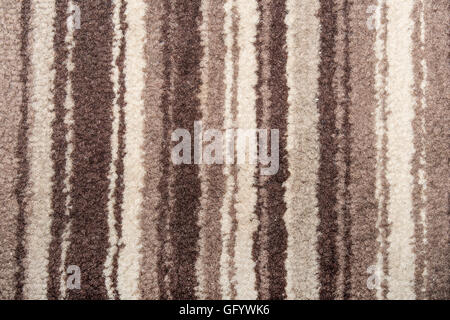 striped carpet that occupies the entire picture in the range of browns Stock Photo