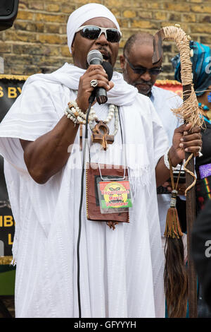London, UK. 1st August, 2016. A man addresses the Afrikan Emancipation Day Reparations rally in Windrush Square, Brixton. The event is intended to act as a vehicle for mobilisation and education and to demand an end to the Maangamizi, the Swahili term for Holocaust. Emancipation Day marks the anniversary of the 1833 Slavery Abolition Act. Credit:  Mark Kerrison/Alamy Live News Stock Photo