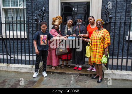 London, UK. 1st August, 2016. A delegation including Esther Stanford-Xoesi, Lindiwe Tsele and Kweme Abubaka prepares to present a petition calling for reparations at 10 Downing Street on Emancipation Day. Emancipation Day marks the anniversary of the 1833 Slavery Abolition Act. Credit:  Mark Kerrison/Alamy Live News Stock Photo