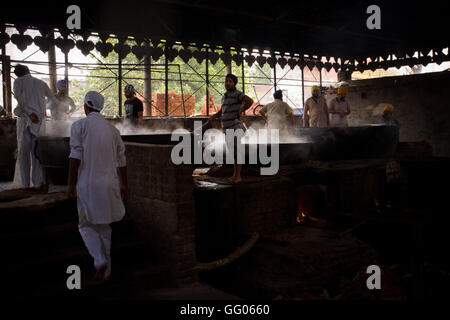 Amritsar, Punjab, India. 12th May, 2013. File Image - Volunteers prepare food for worshippers and pilgrims in the kitchen of the Golden Temple complex in Amritsar, India. The Golden Temple, also known as Harmandir Sahib, is the main destination of pilgrimage for Sikhs. Note for Editors: This image belongs to a personal work that was shot on 2013 along Iran, Turkey and India named ''The Passenger - Lost Photos' © Jordi Boixareu/ZUMA Wire/Alamy Live News Stock Photo