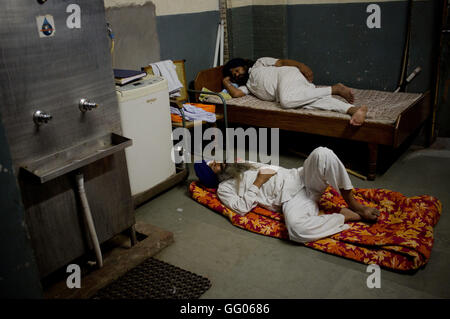 Amritsar, Punjab, India. 12th May, 2013. File Image - Two men sleep inside the Golden Temple complex in Amritsar, India. The Golden Temple, also known as Harmandir Sahib, is the main destination of pilgrimage for Sikhs. © Jordi Boixareu/ZUMA Wire/Alamy Live News Stock Photo