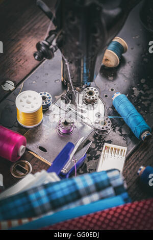 Sewing background concept with cotton fabric, spools of thread and scissors Stock Photo