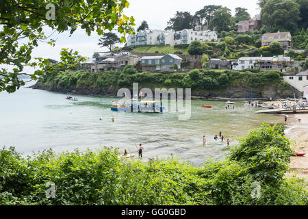 People being transferred from the sea tractor to the South Sands Ferry at South Sands near Salcombe in Devon Stock Photo