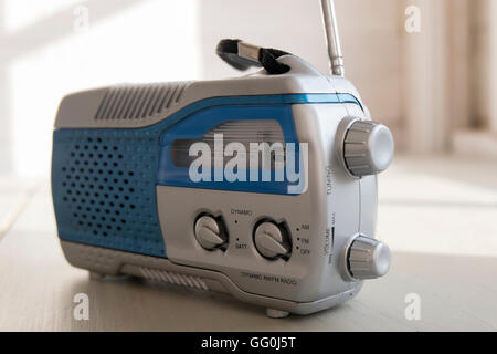 Close-up of a dusty old AM FM wind-up radio. Stock Photo