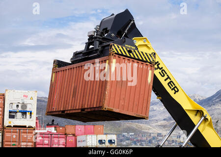 Hydraulic Hyster forklift truck lifting freight shipping containers in port. Atlantic Harbour, Nuuk Sermersooq West Greenland
