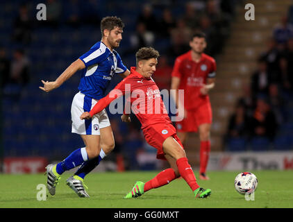 Chesterfield's Ched Evans (left) and Leicester City's Matt Miles battle for the ball during the pre-season friendly match at the Proact Stadium, Chesterfield. Stock Photo