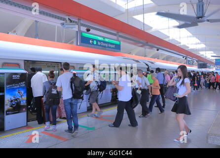 People take MRT at Tanah Merah Station in Singapore. Stock Photo