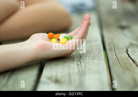 Colourful jelly beans in a cupped hand. Stock Photo