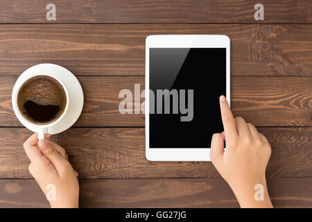 female touch on white tablet blank screen on top view Stock Photo
